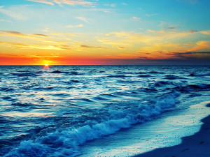 blue ocean water beach at sunset